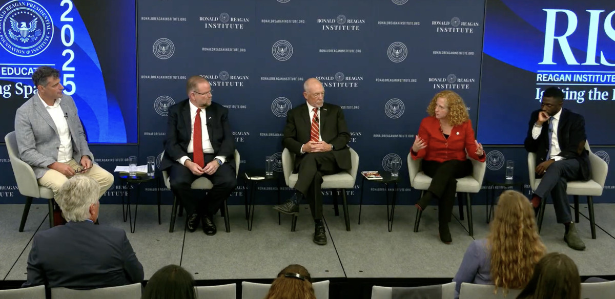 Chancellor Jennifer Mnookin interacts with other panelists at the Reagan Institute panel on the future of higher of education. 