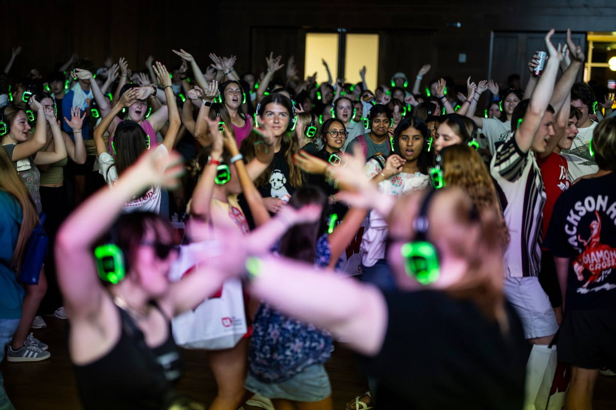 Students dance at the silent dance party. 