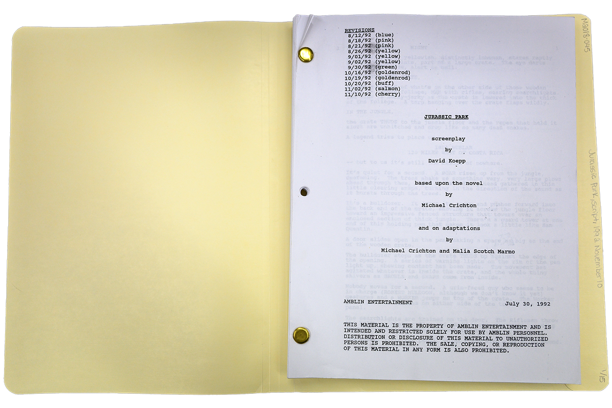 A yellow folder labeled 'Jurassic Park' contains a screenplay by David Koepp, based on Michael Crichton's novel, with revision dates, all in 1992, and a copyright notice visible.