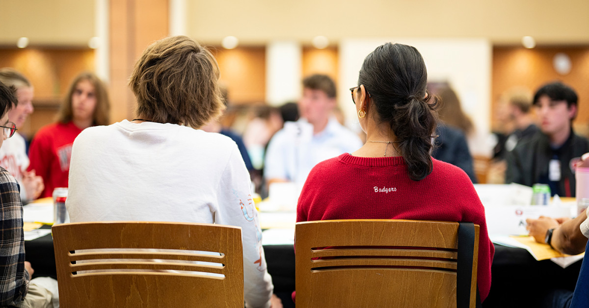 Group of people in conversation around a table