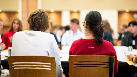 Group of people in conversation around a table