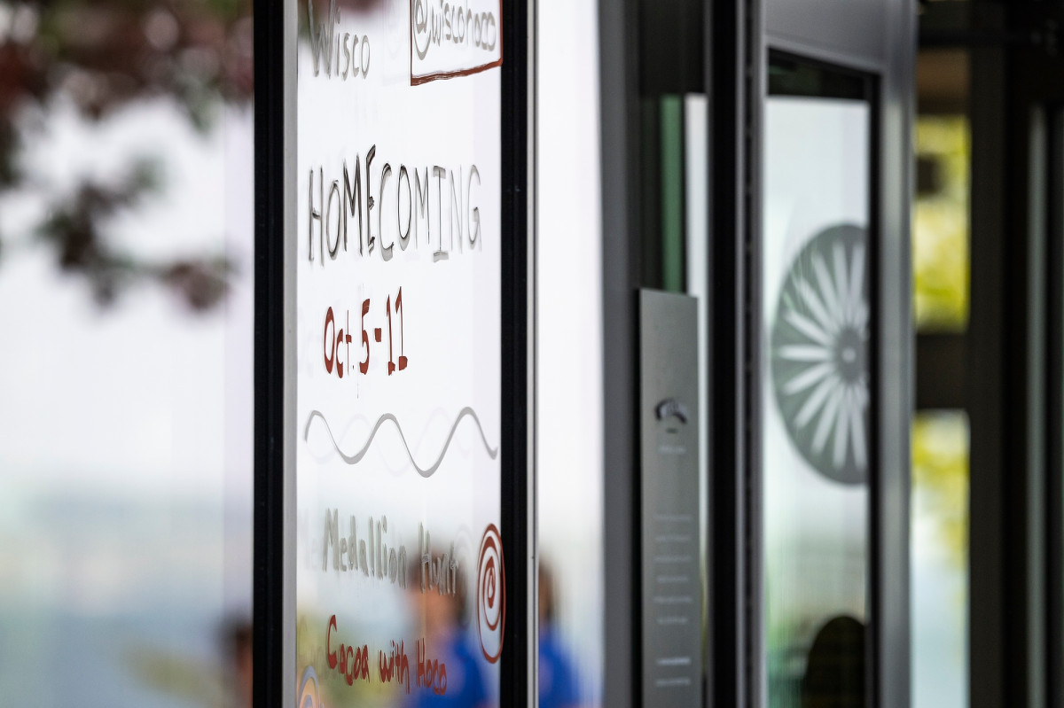 A close-up of one of the window designs shows the dates for this year's homecoming celebration.