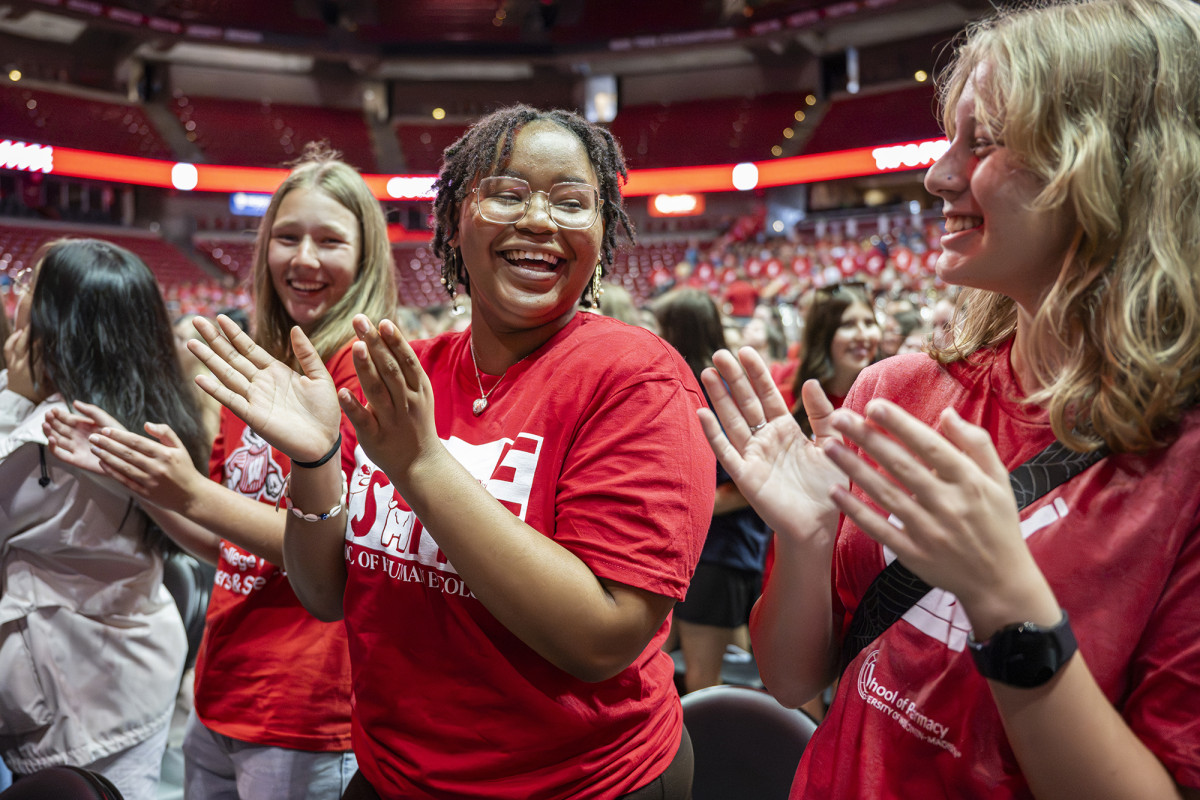 Smiling group of students clapping