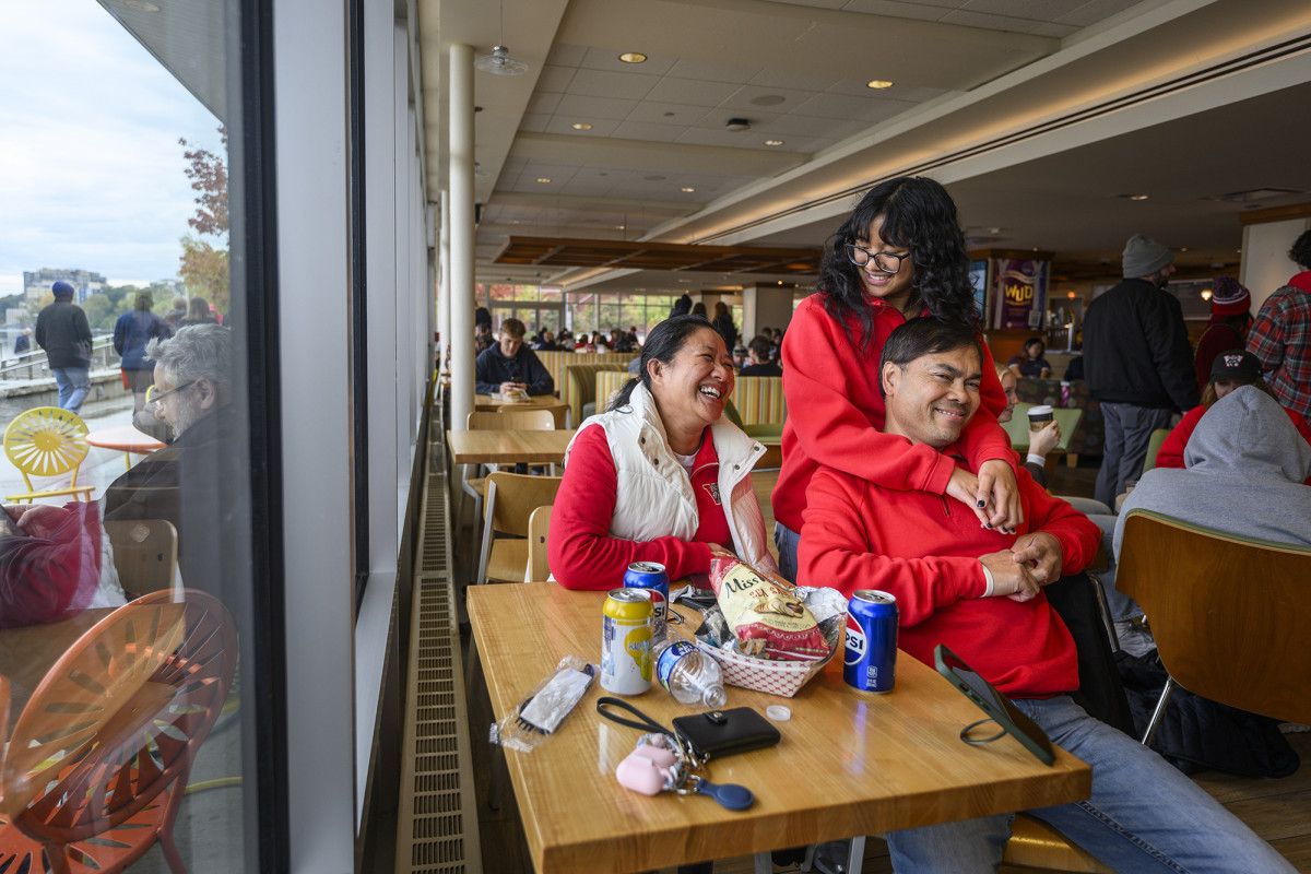 A family sitting at a table smiling