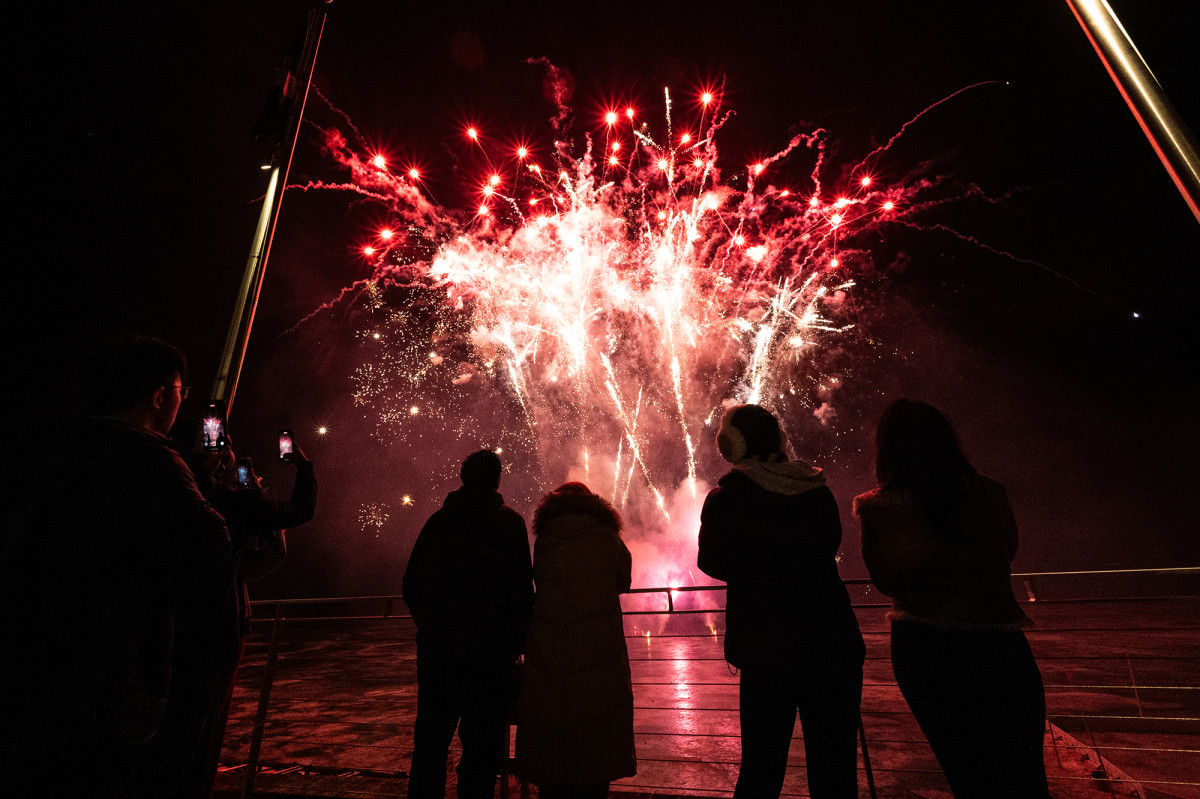 A small group viewing fireworks