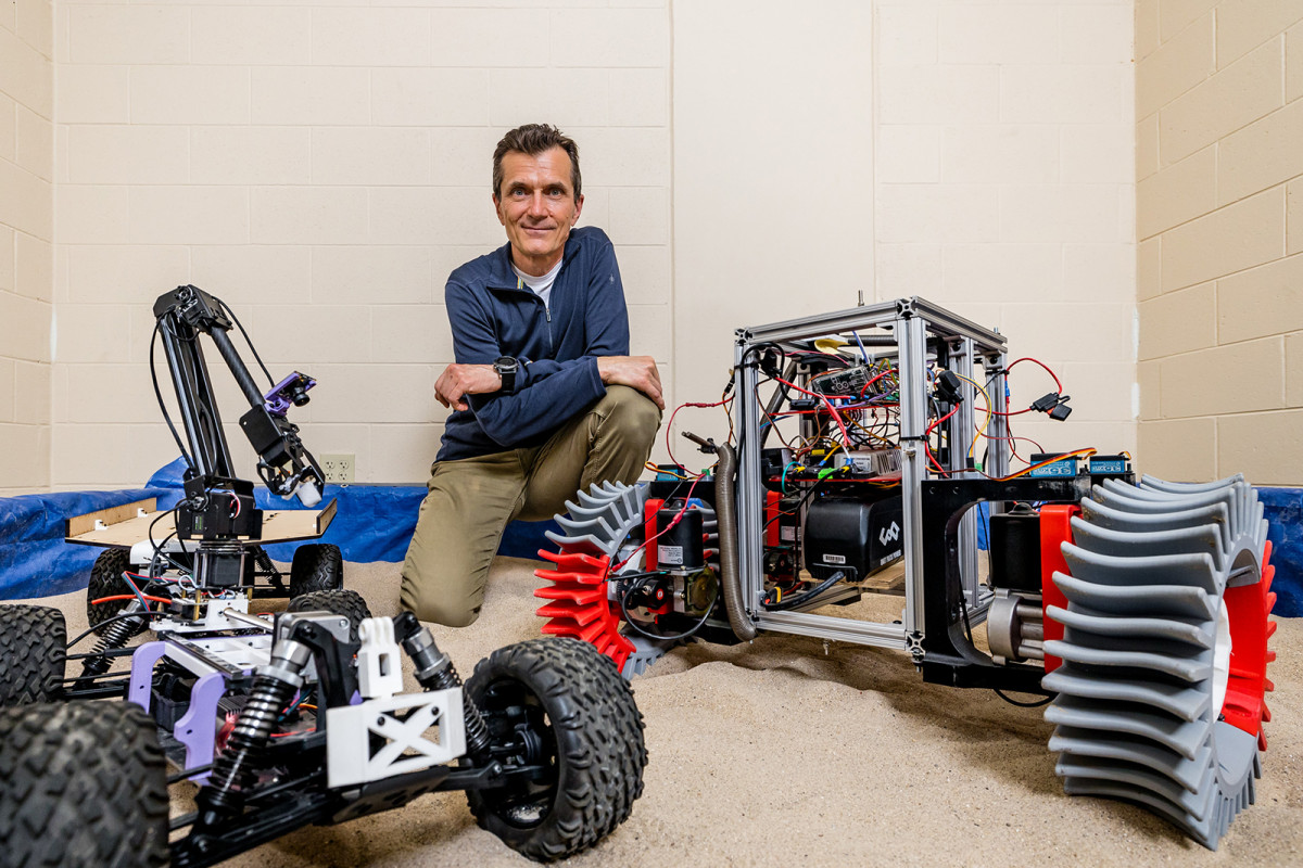 Dan Negrut poses with a space rover