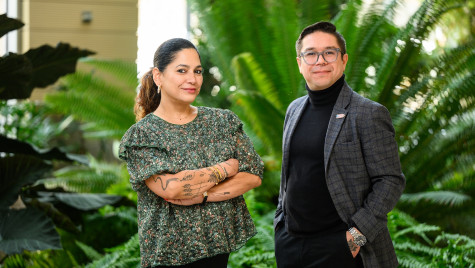 Portrait of Professors Aurora Santiago Ortiz and Jorell Melendez-Badillo at the Wisconsin Institute for Discover, with green plants in the background.