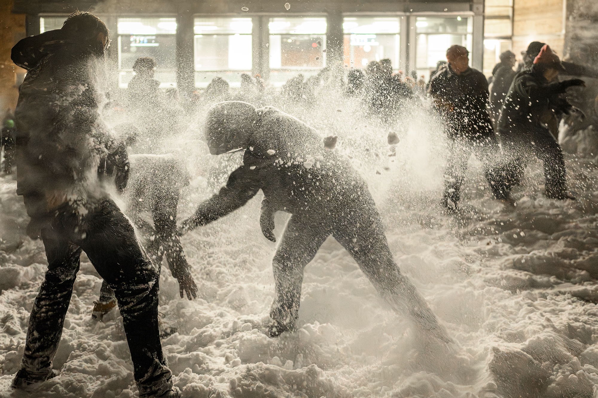 Snow flying around students