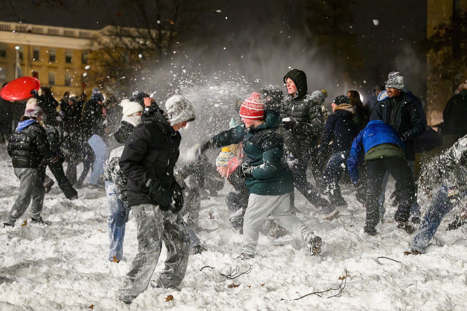 Dozens of students throw snowballs