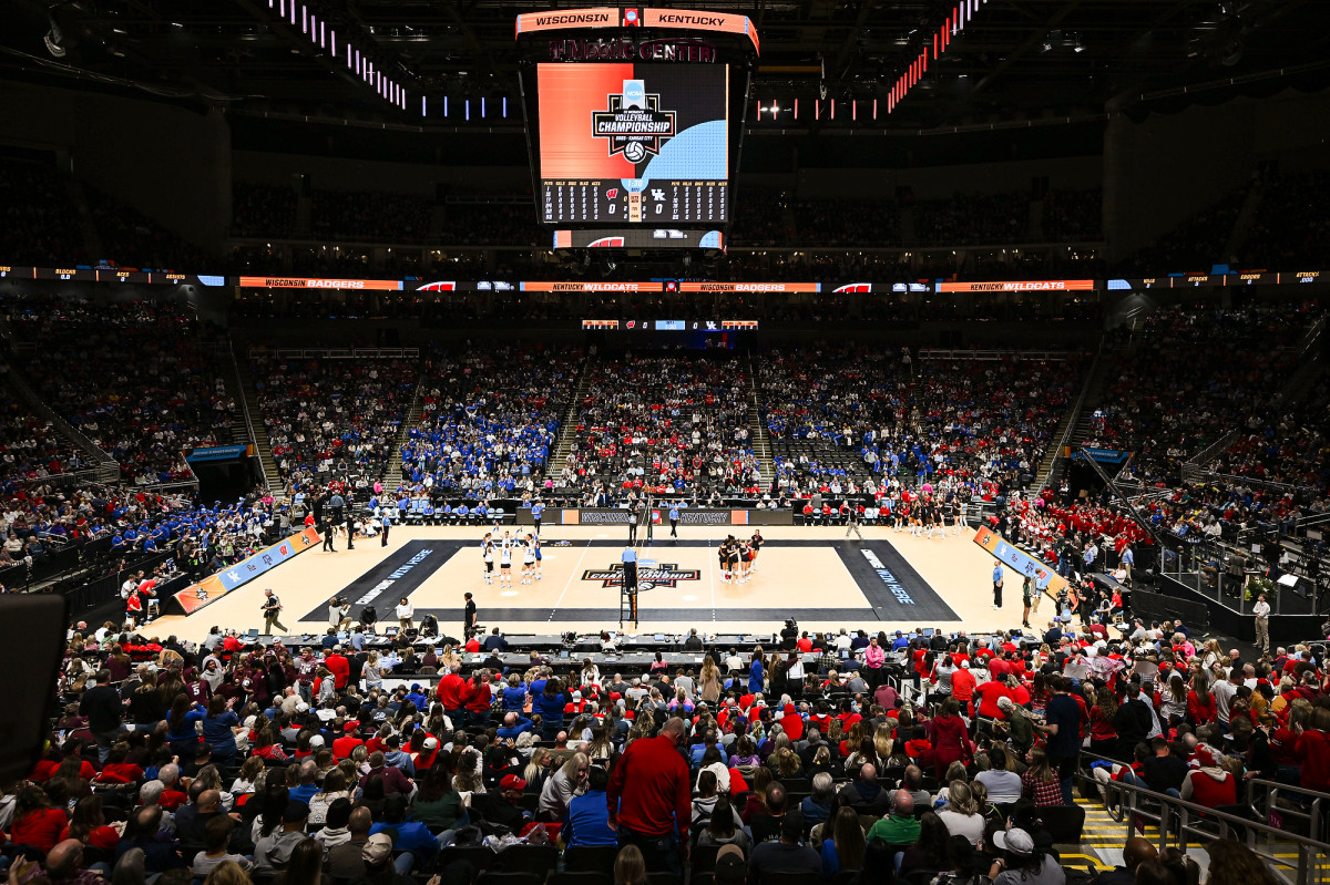 A wide interior shot of the T-Mobile Center, full of fans wearing red and blue.