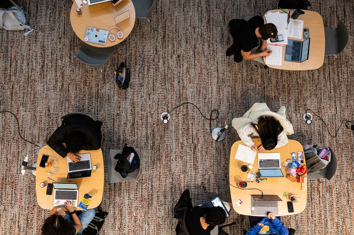 From above, four tables each show a different scene of students studying.