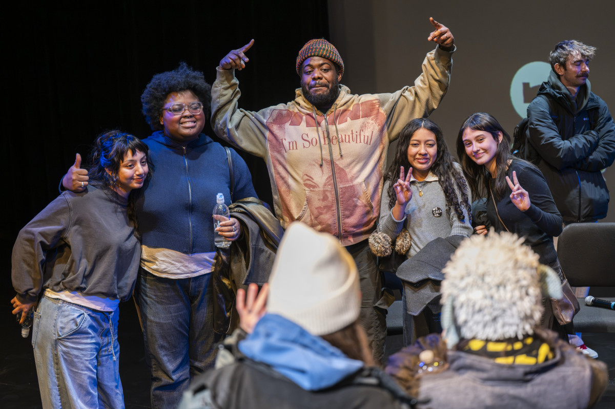 MIKE poses for a photo with UW–Madison students.