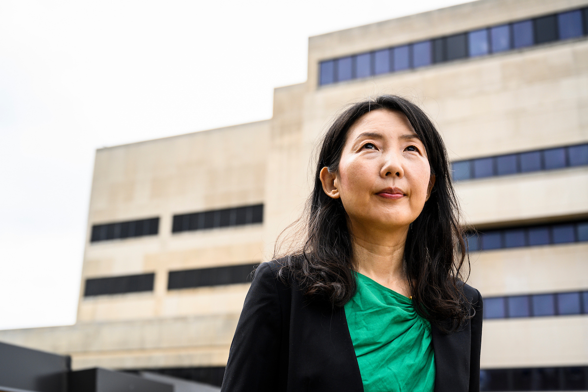 A photo of Young Mie Kim standing outside College Library