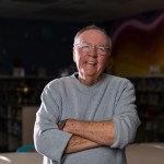 James Patterson smiles in a school classroom