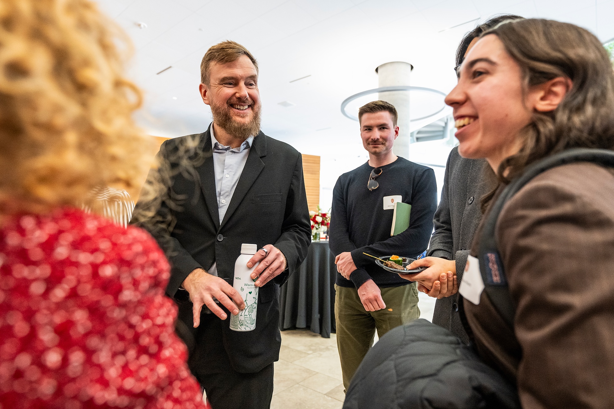 Greg Lukianoff speaks with UW students who attended the event in the lobby of the Discovery Building.