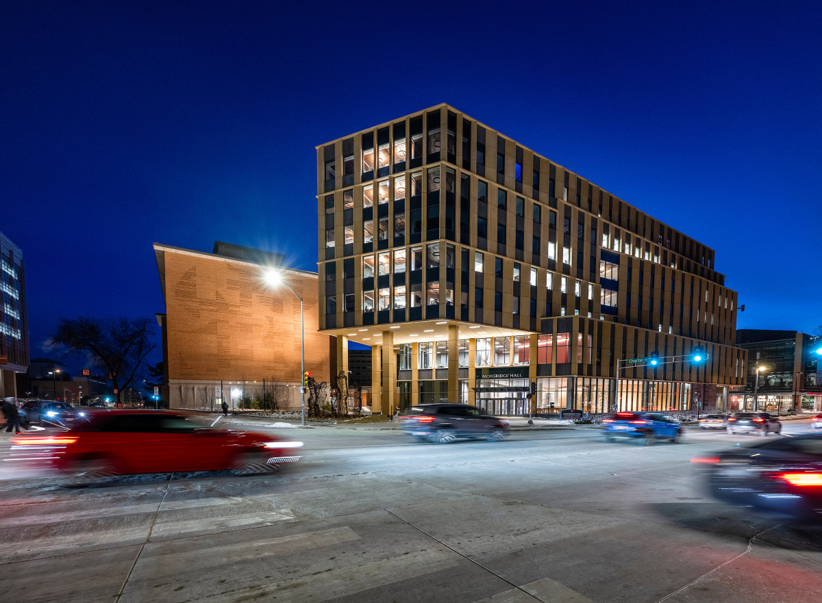 An exterior shot of the newly constructed Morgridge Hall shines at night.