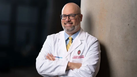 Portrait of Christian Capitini in a lab coat.