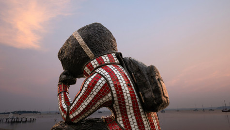 Smoke-filled air surrounds a statue of Bucky Badger overlooks Lake Mendota.