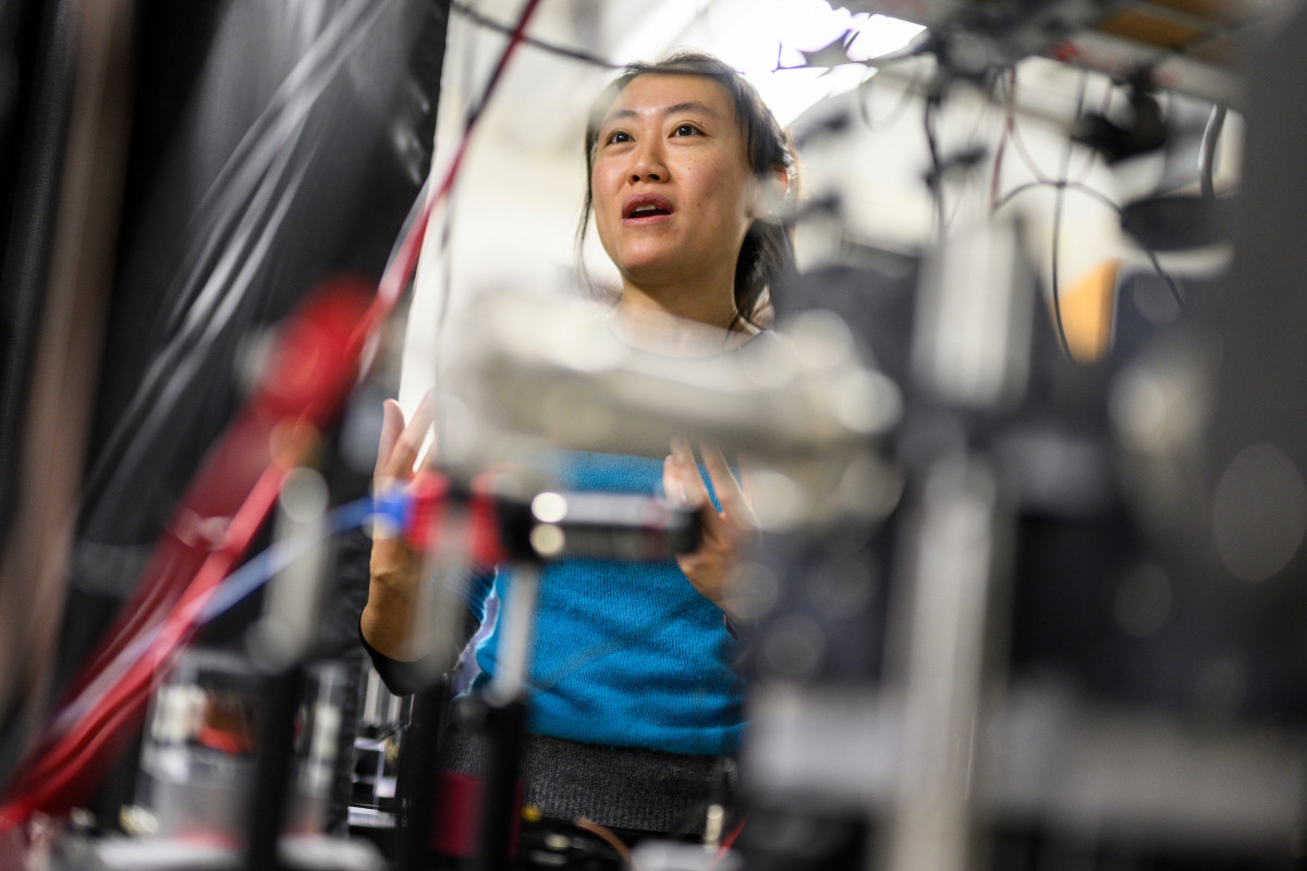 Choy explains quantum research among the computers used in her studies.