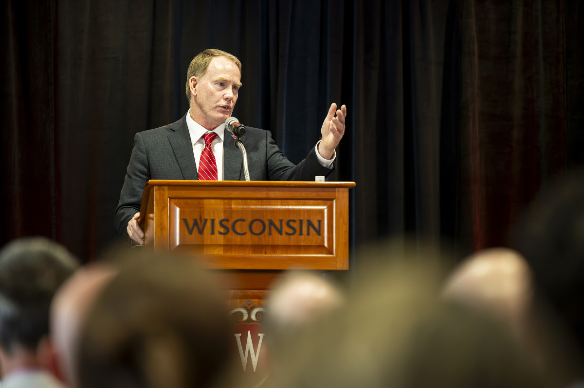 Chris Eichorst speaks at podium