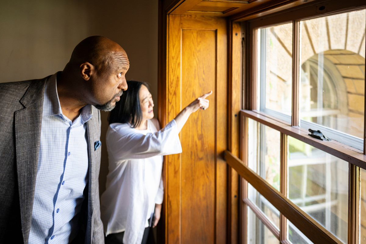 Charles Isbell, Provost and Vice Chancellor of Academic Affairs at the University of Wisconsin–Madison, looks out a window overlooking the courtyard as he takes a tour of Bascom Hall with Eden Inoway-Ronnie, chief of staff to the provost.
