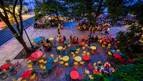 People enjoy a beautiful summer evening during the Fourth of July Stars Stripes and Shorelines event on the Memorial Union Terrace at the University of Wisconsin–Madison on July 4, 2026.
