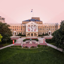 Bascom Hall building on the UW–Madison campus with a pink sky and trees