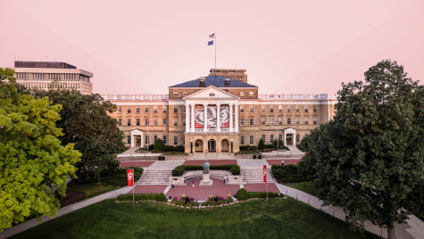 Bascom Hall building on the UW–Madison campus with a pink sky and trees