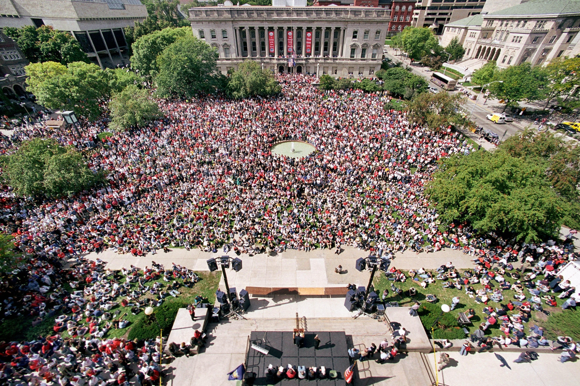 An aerial view of thousands of people gathered at Library Mall for a remembrance event.