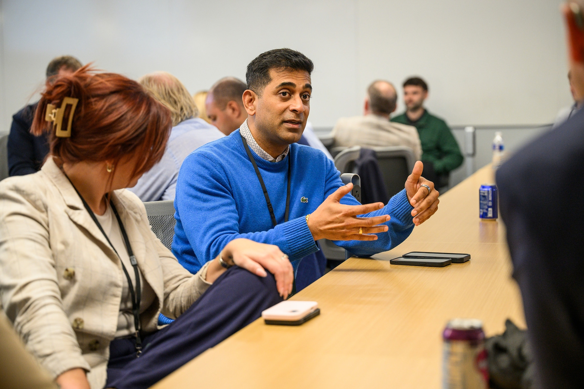 Subin Amarnathan gestures with his hands while speaking at a table.
