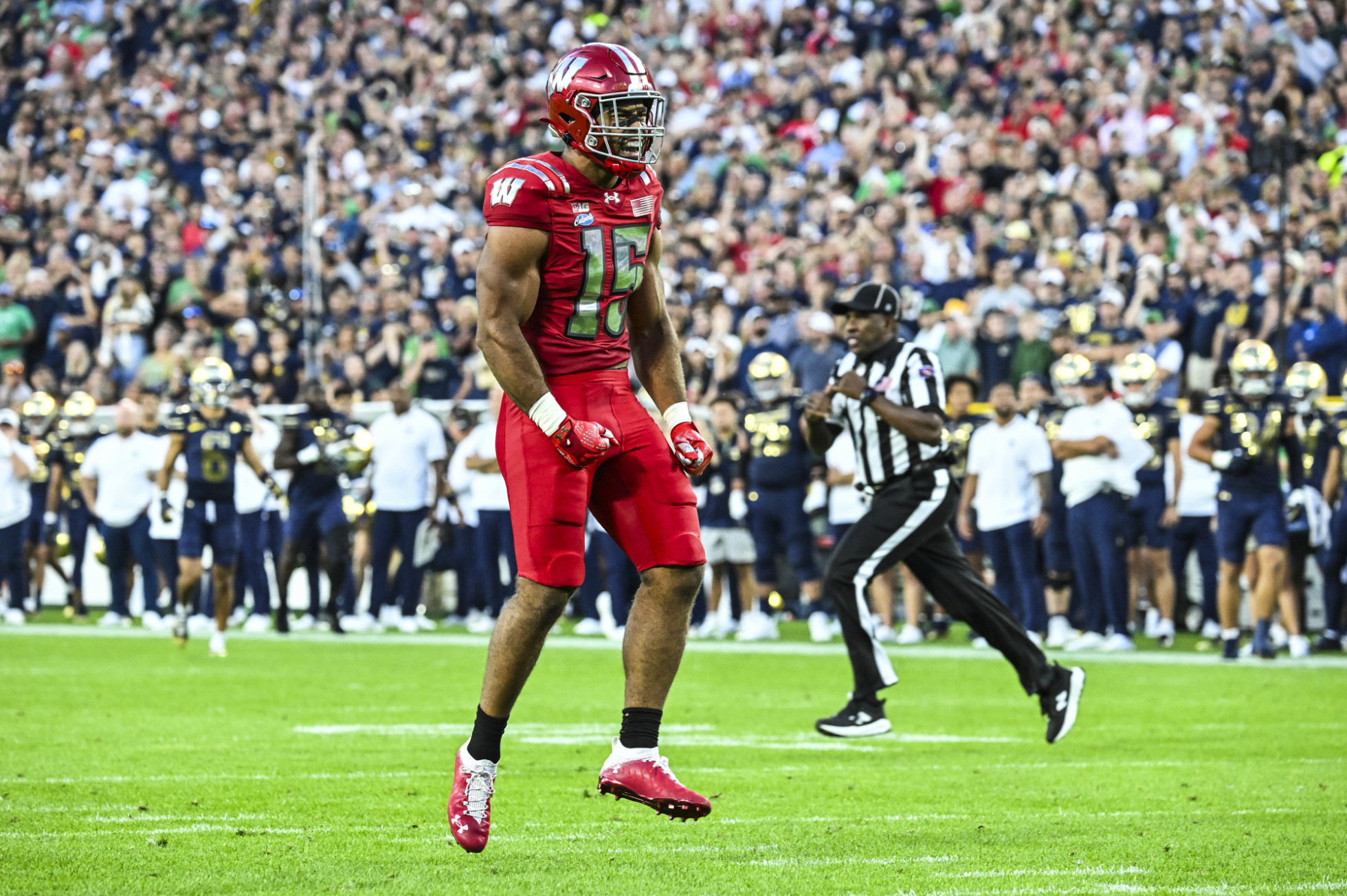 Badger football player Sebastian Cheeks celebrates on the field. 