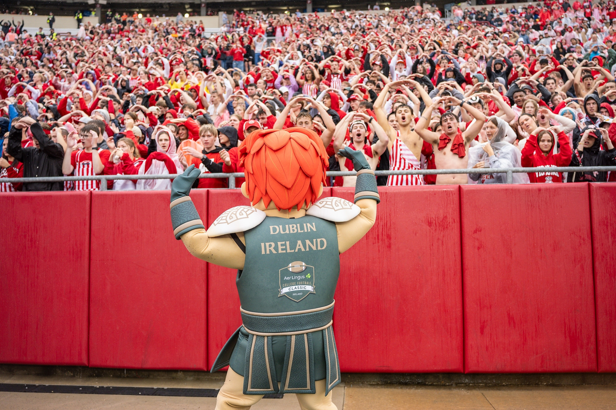 The Celtic the Brave mascot leads the UW Student Section in cheers at Camp Randall Stadium.