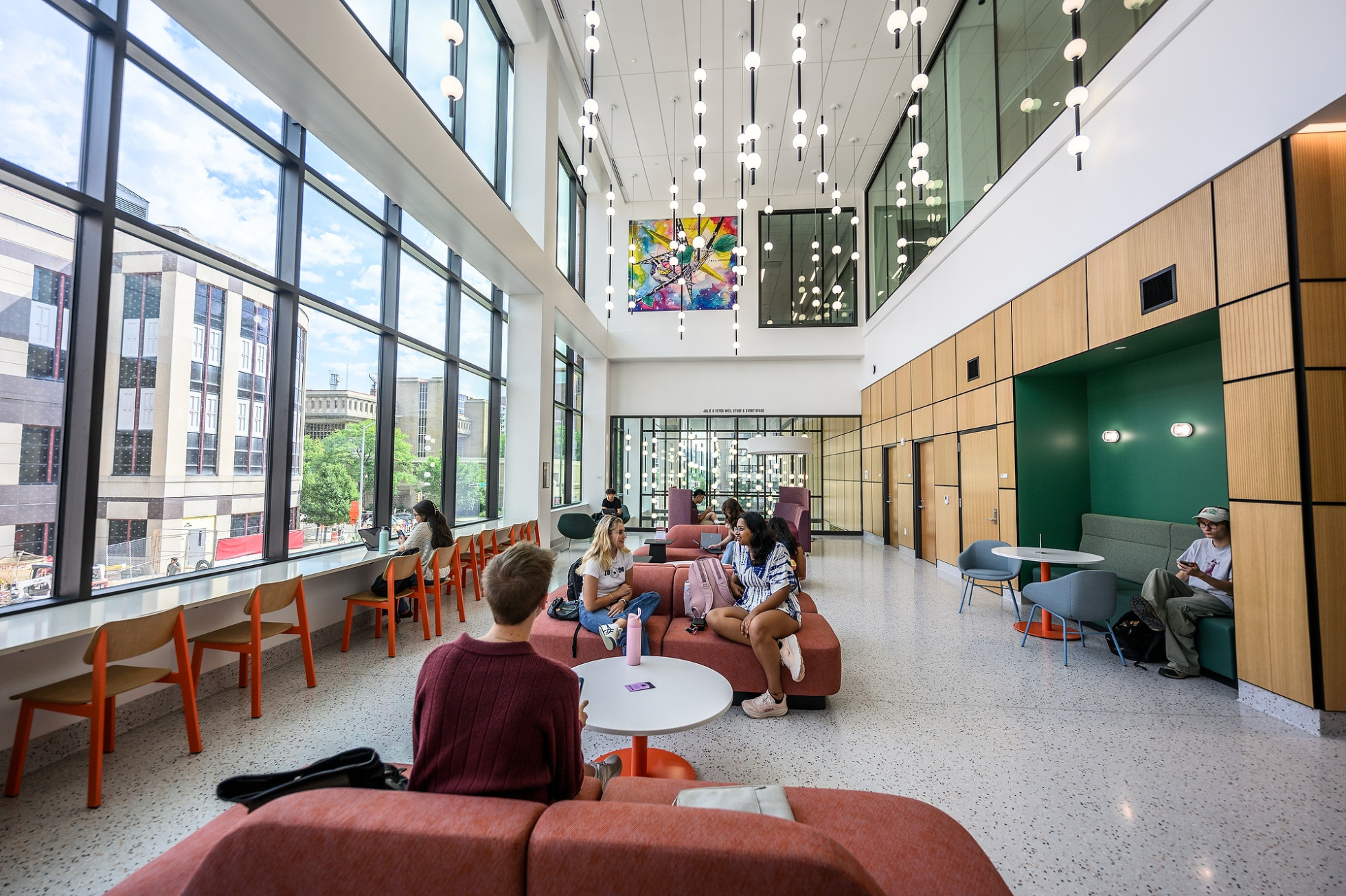 Students sit in a lounge area of Levy Hall.