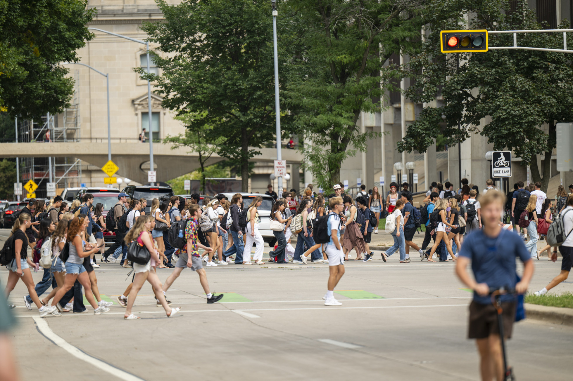 Many students cross the street on campus on the first day of fall classes at UW–Madison.