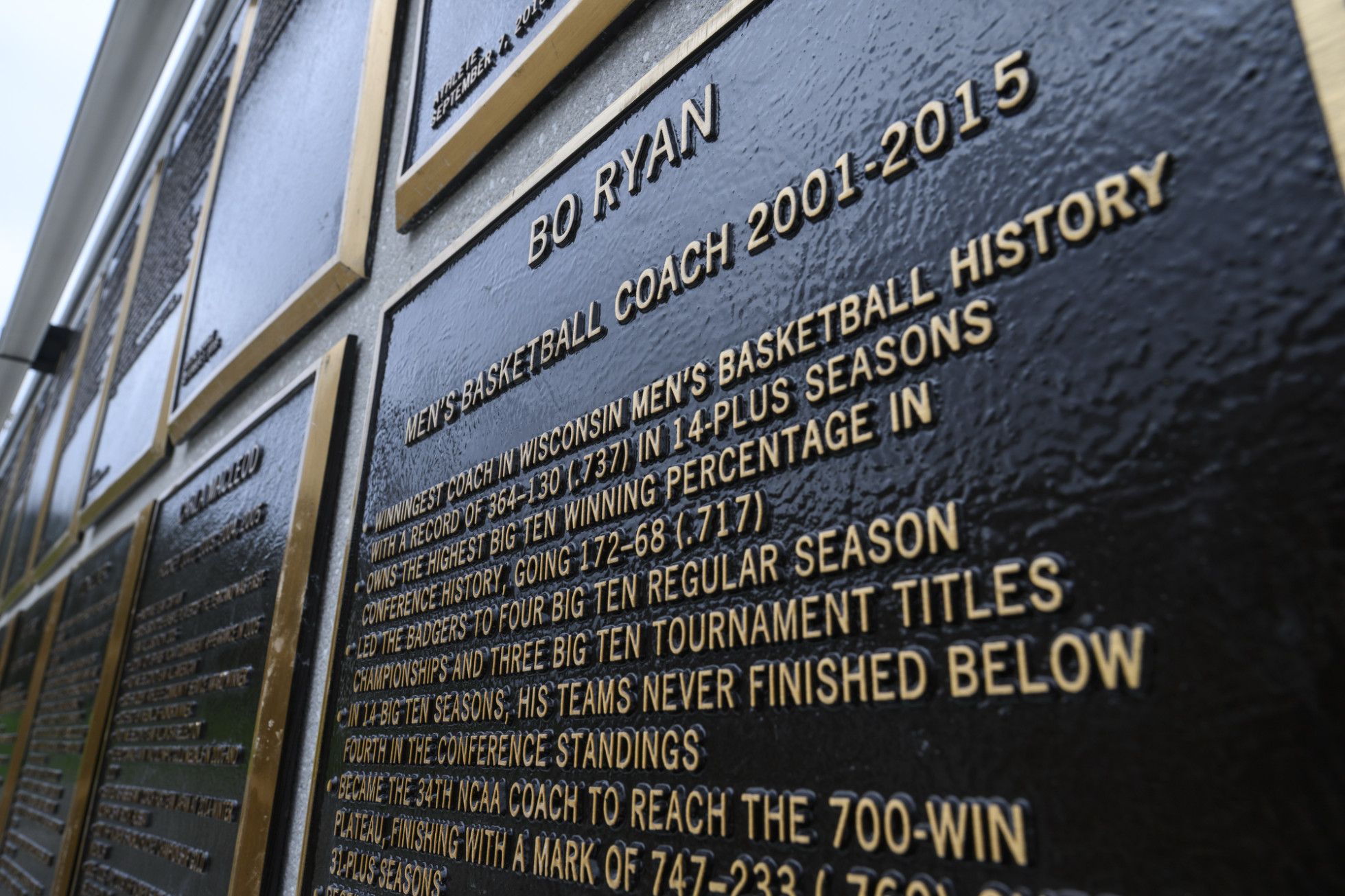 A close-up view of a Hall of Fame plaque for former Badger basketball coach Bo Ryan.