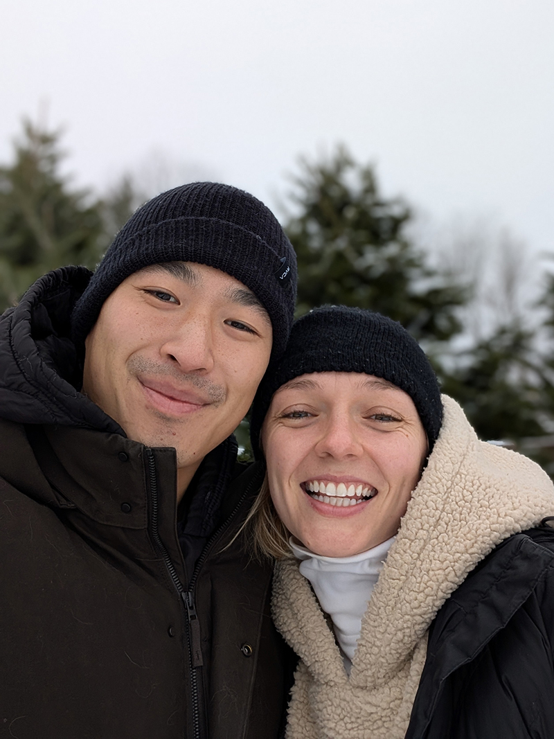 Student Marlee Rae Lee pictured outdoors in winter attire with her husband Meng Hsuan