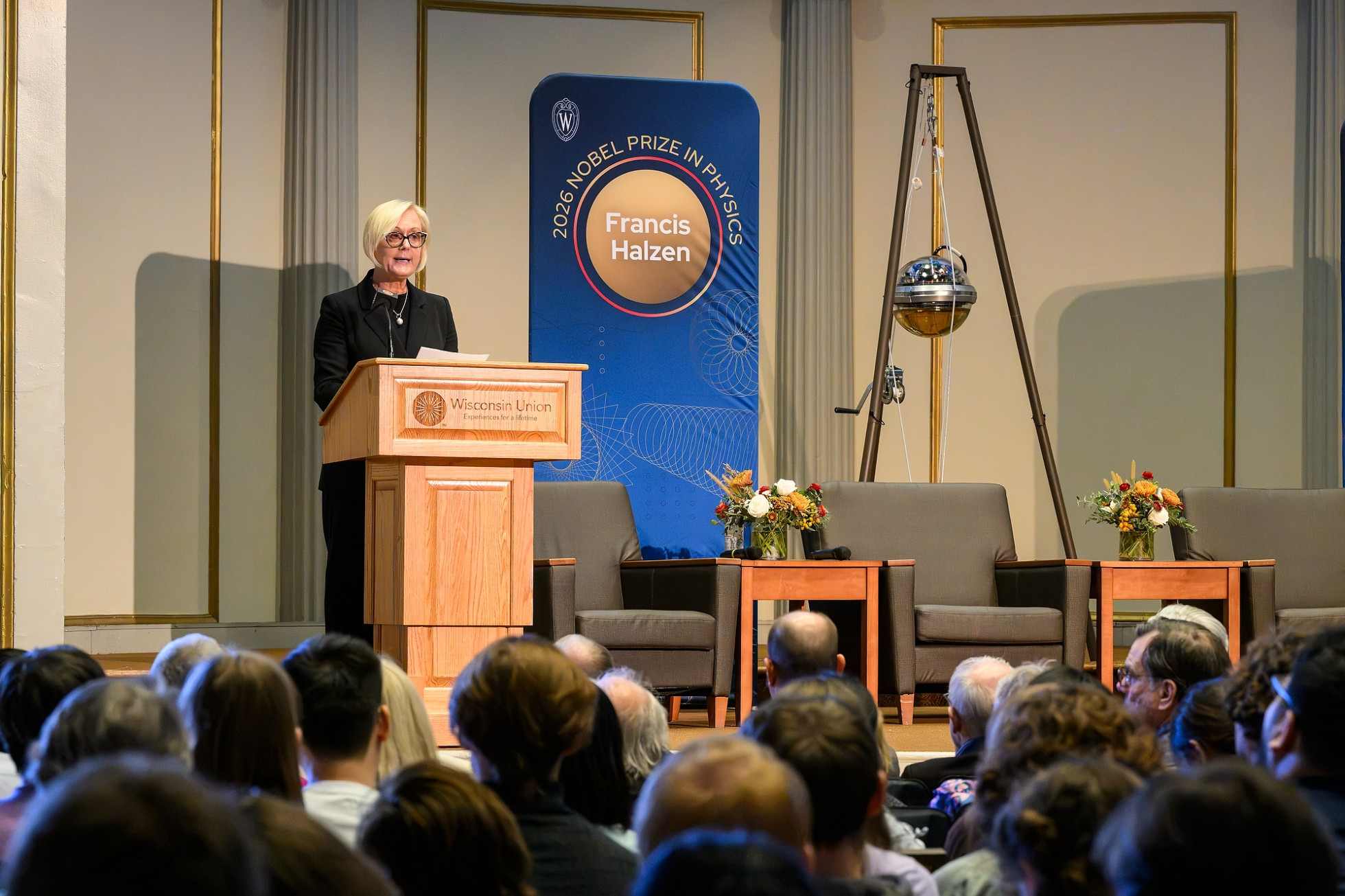 Vice Chancellor for Research Dorota Grejner-Brzezinska standing at a podium on a stage speaking to a crowd
