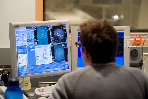 Photo: Researcher monitoring computer displays